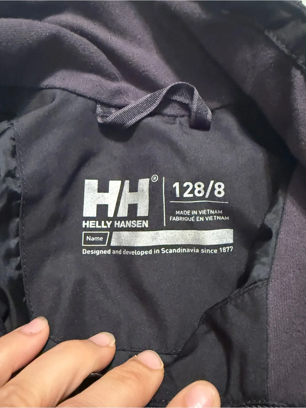 Child’s Size 8 / 128 Black Helly Hansen Waterproof Rain Jacket. Good Condition.